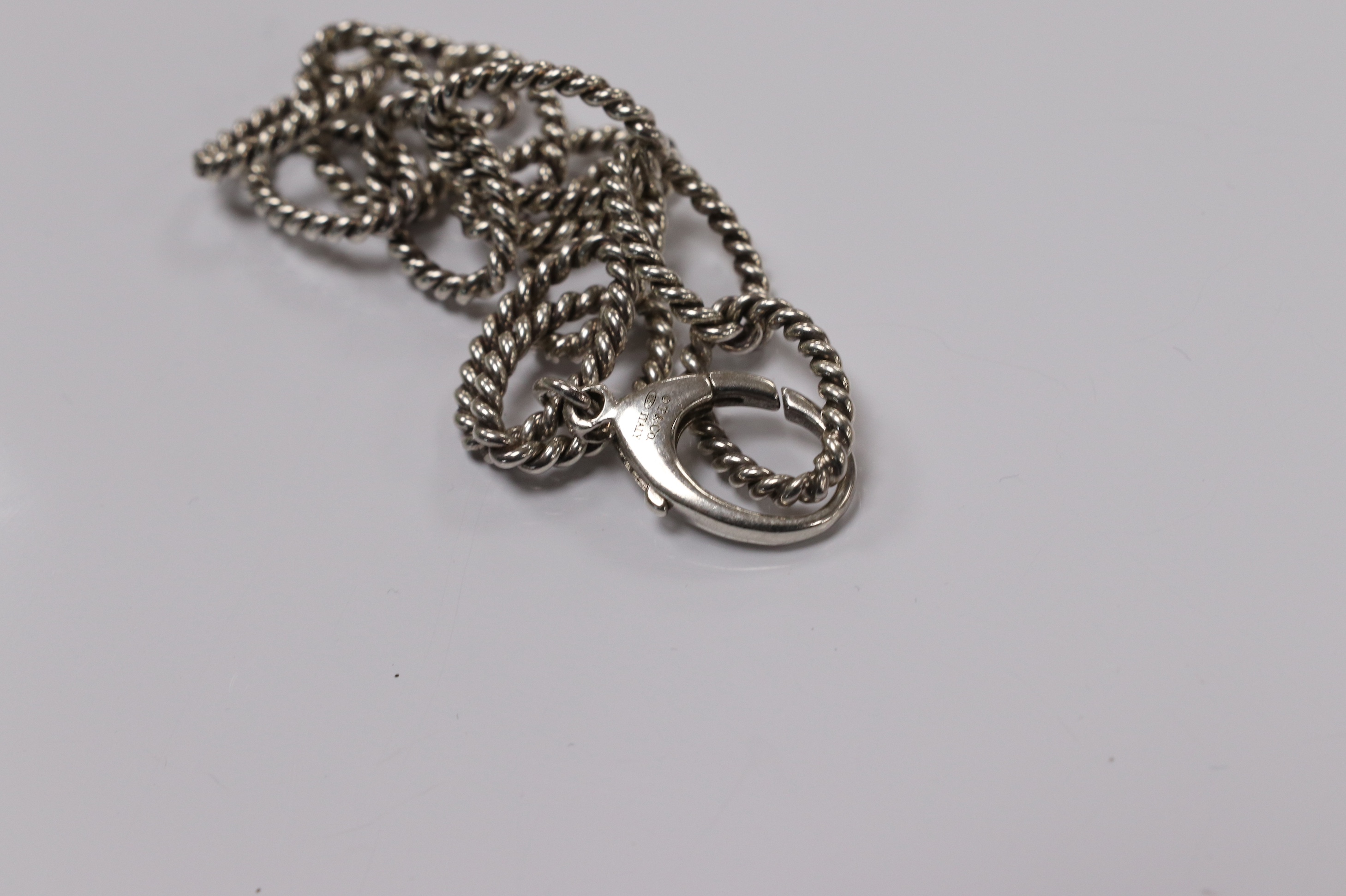 A modern Italian Tiffany & Co 925 suite of jewellery, of rope twist design, comprising a necklace, 42cm, bracelet, 18cm and two rings, size O/P and O. Condition - fair to good